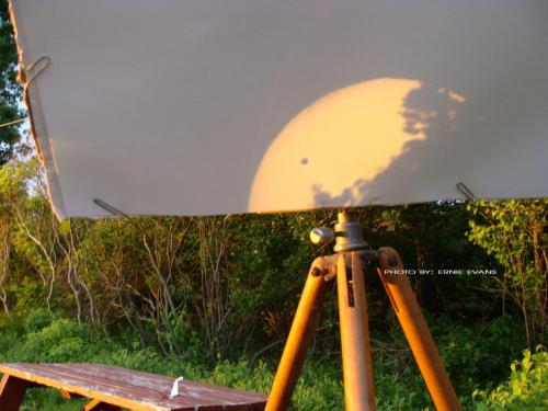 This is a shot submit by Ernie Evans of the Transit of Venus as seen in Ninigret Park. In this shot the Transit is being projected from a 4' Dynascope Newtonian telescope with a 75x eyepiece onto a white screen.