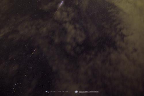A Perseid fireball through the clouds during the 2016 Perseid peak at Frosty Drew Observatory. Image credit: Frosty Drew Astronomy Team member, Scott MacNeill