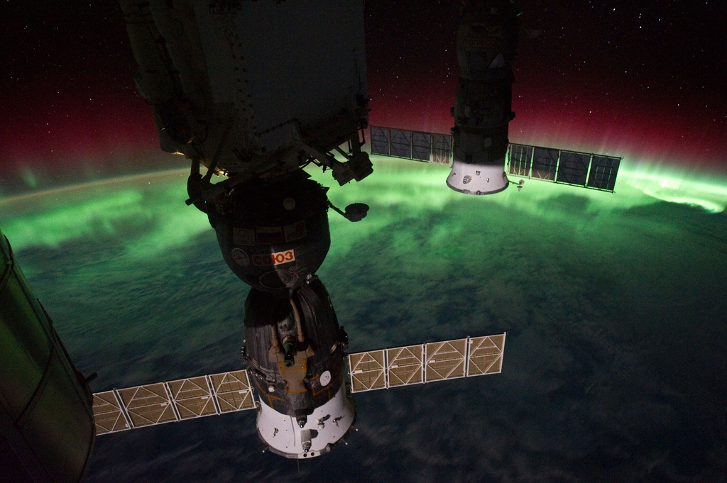 The International Space Station over the Aurora Borealis