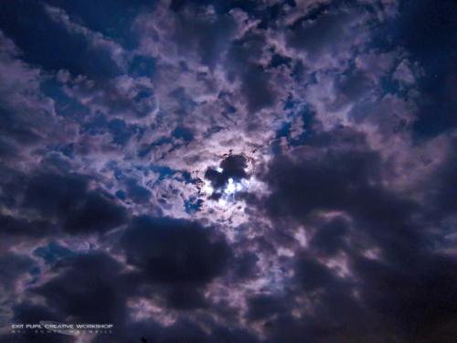 The Blue Moon obscured by clouds over Ninigret Park by Frosty Drew Astronomy Team member, Scott MacNeill