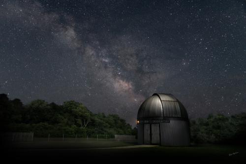 The Milky Way stretches over the Frosty Drew Observatory. Credit: Bob Mattera captured this image in 2022.