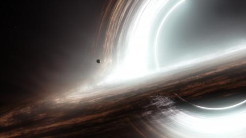 An accurate representation of a spinning black hole with an accretion disk. The accretion disk appears to surround the event horizon due to gravitational lensing, which allows us to see the part of the accretion disk on the other side of the black hole.